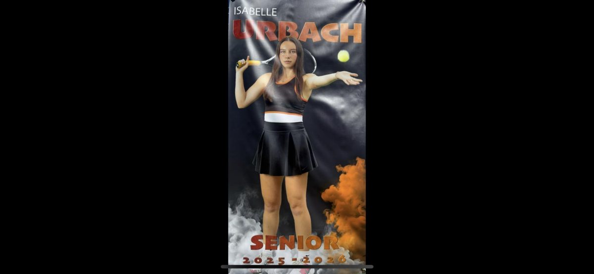  Isabelle’s senior tennis poster hanging on the fence of the tennis court