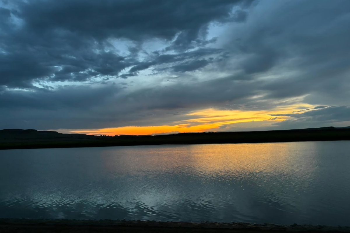The sunset reflects ominously over the lake where the summer scare took place.