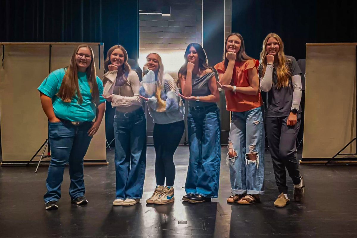 Junior girls pose after getting their photos done on picture day.