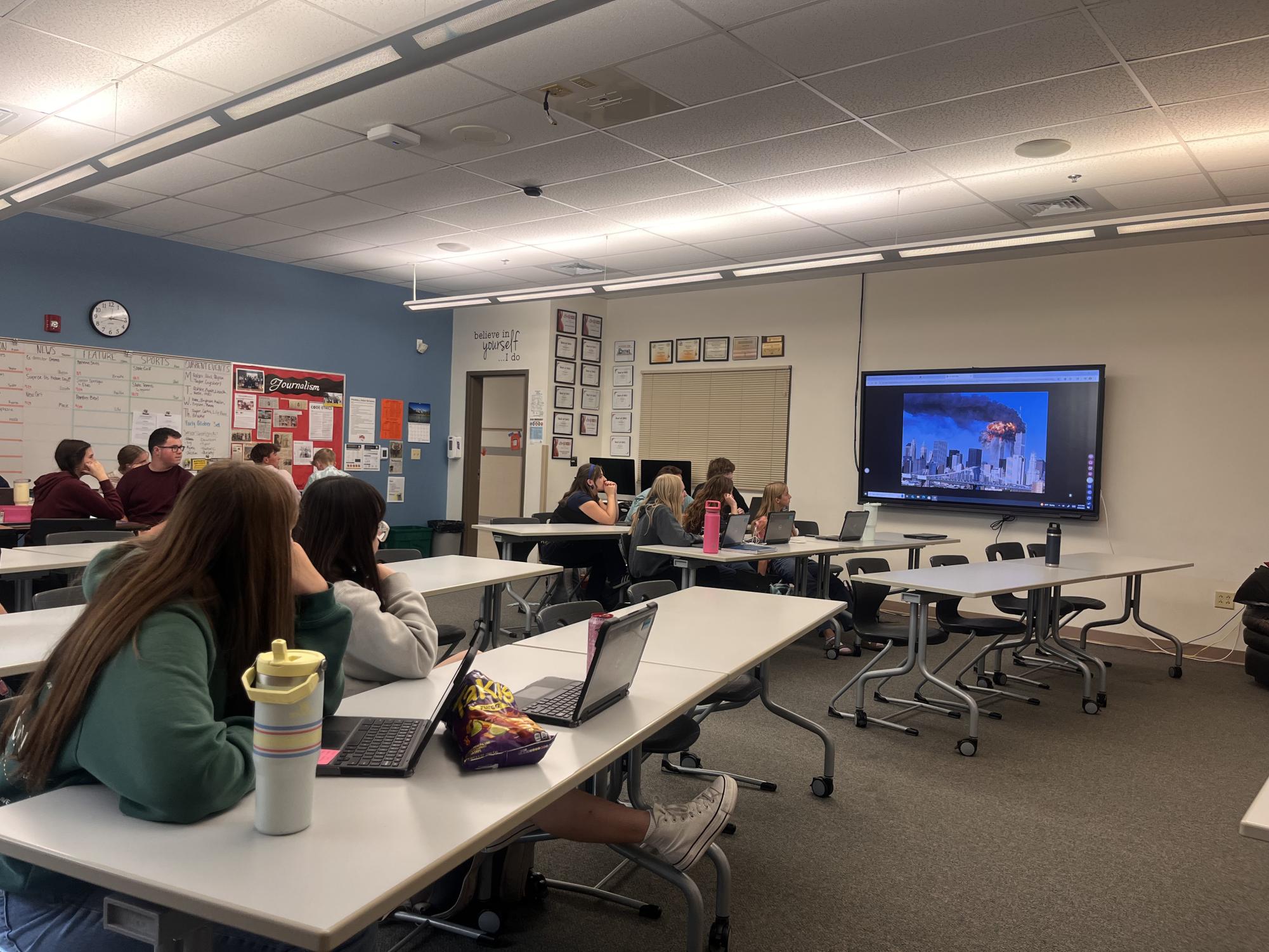 Students view visuals of the attack on the Twin Towers to be reminded of the tragedy.