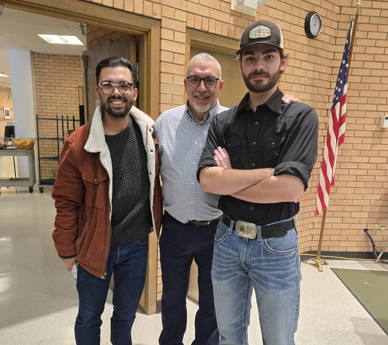 PHS alumni Braden Schiller (left) and Nathan Feller (right) gather at the 2025 WSMA Conference, along with keynote speaker and former Prowl adviser Vin Cappiello.