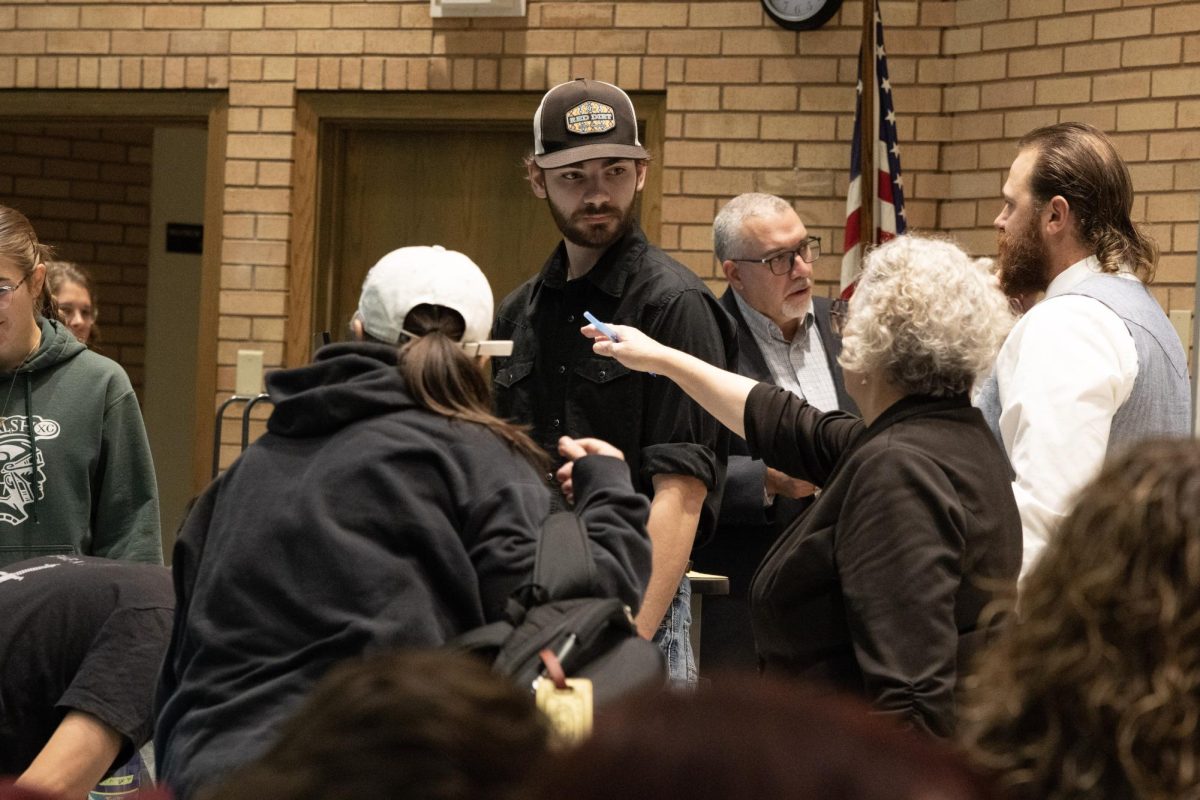 Nathan Feller talks to Northwest College professors during the 2025 WSMA confrence.