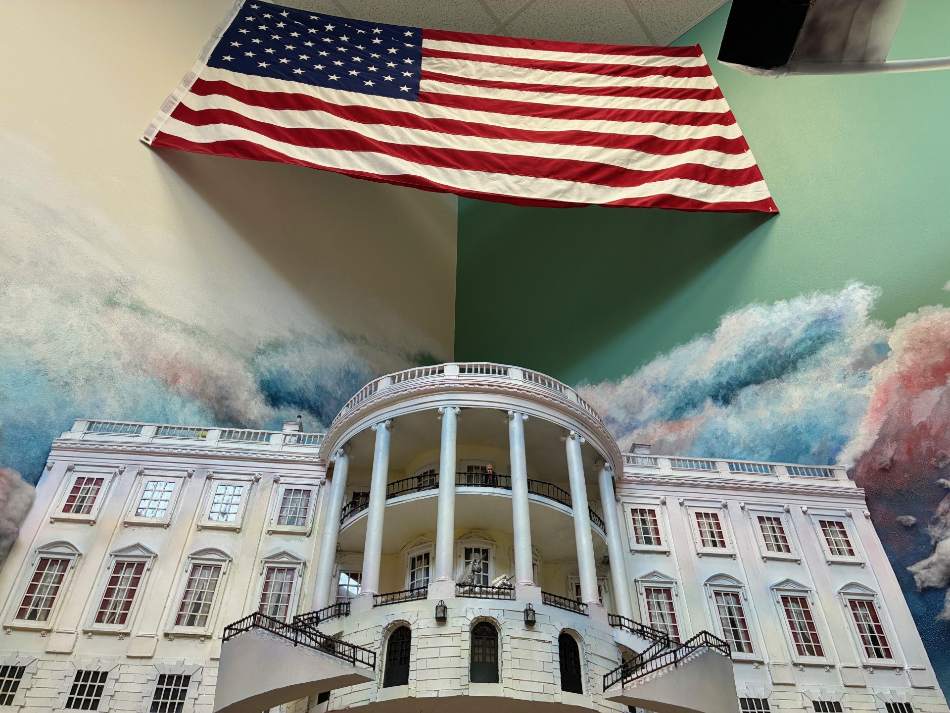  Powell High School's depiction of the White House, close but still separate from the United States flag.