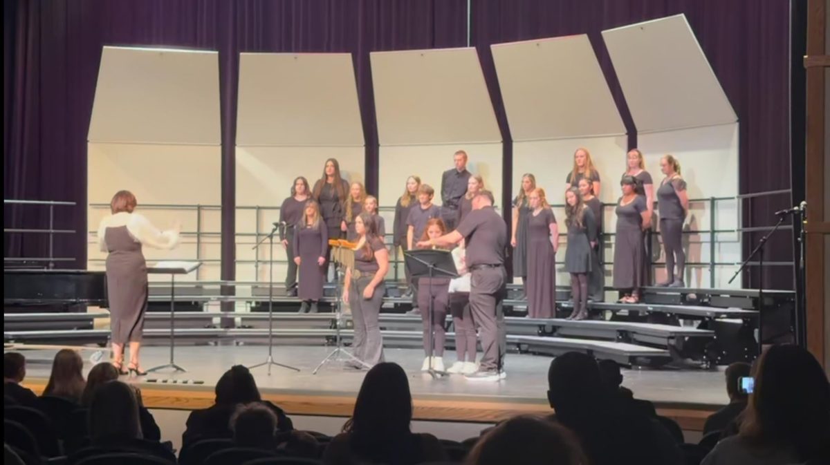 Powell High School’s beginning choir, PHS singers, perform their song “Listen” with three Westside students. 