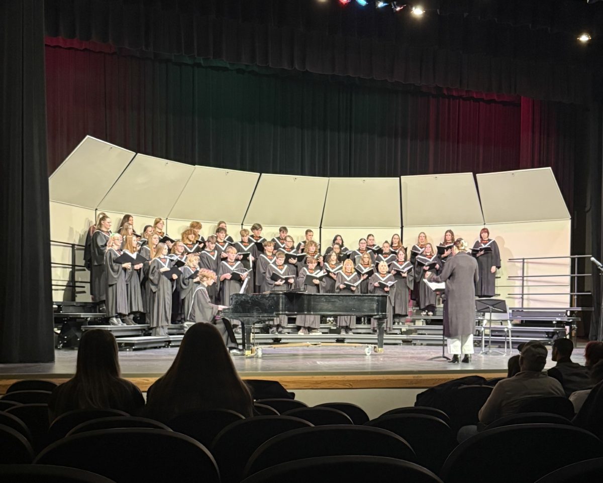 The concert choir getting ready to perform their first song, Rise Up Shepherd.