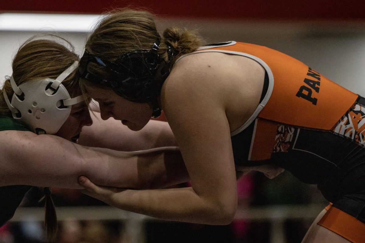 Elora Joy wrestles in an intense match at Ron Thon. 