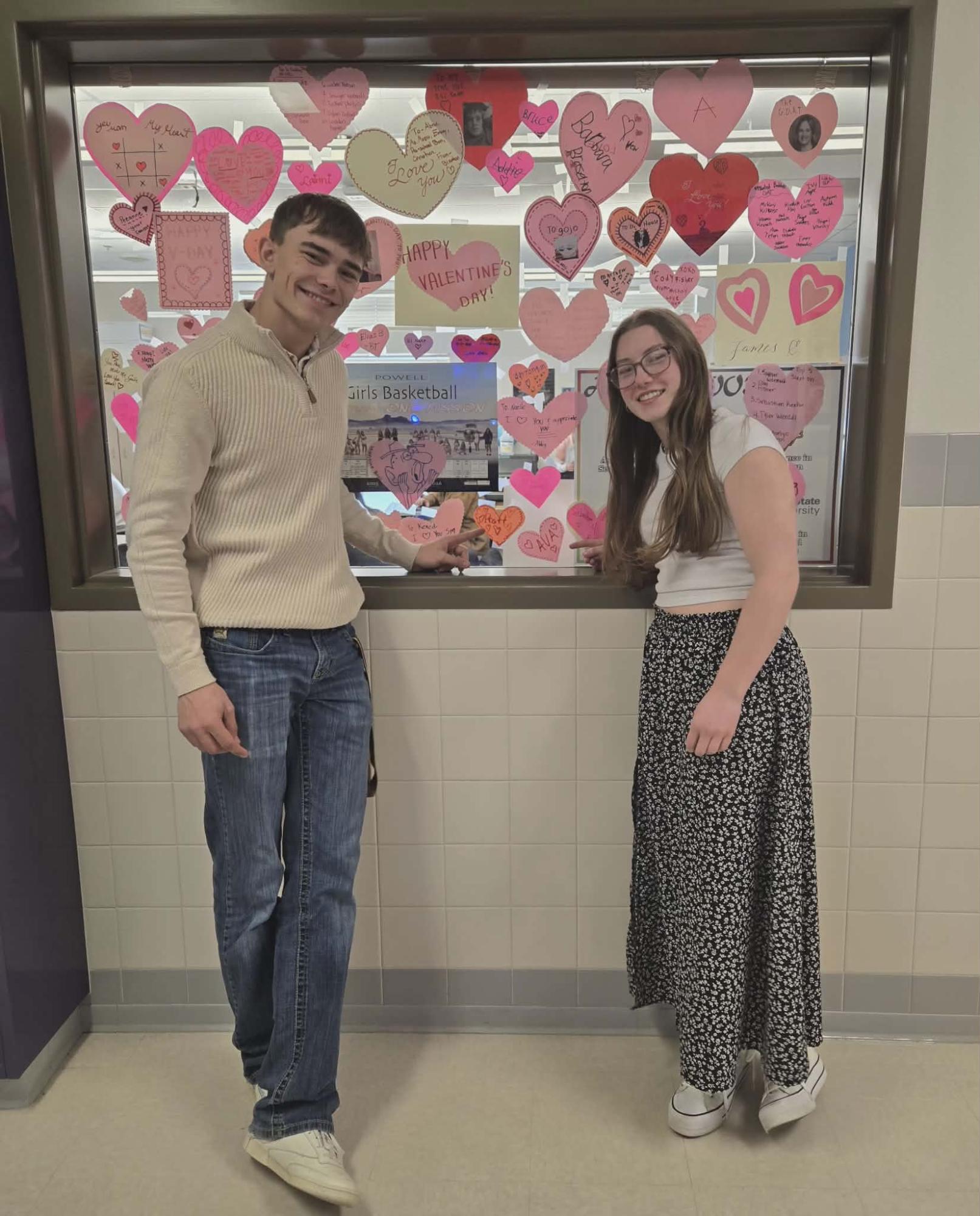 Juniors Pratt Wambeke and Ava Teten point to the valentines they made for each other this year.