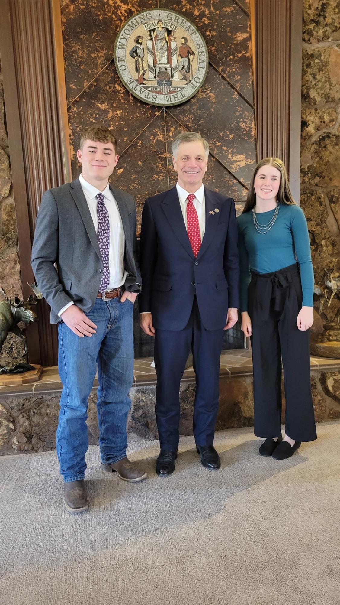 Senior Dawson George and junior Cambree Dicks meet with the Governor of Wyoming, Mark Gordon.