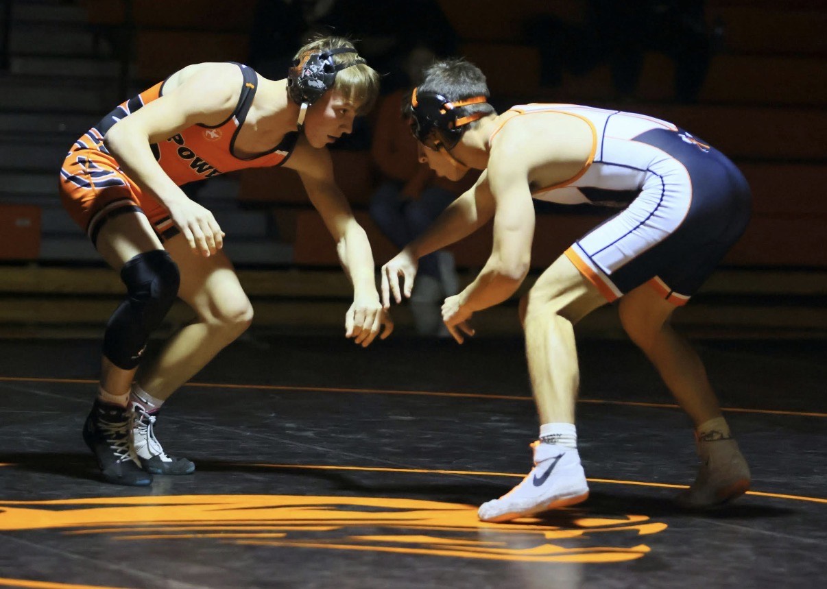 Freshman Russell Goolsbey (126 lbs.) circles around with his wrestling opponent.