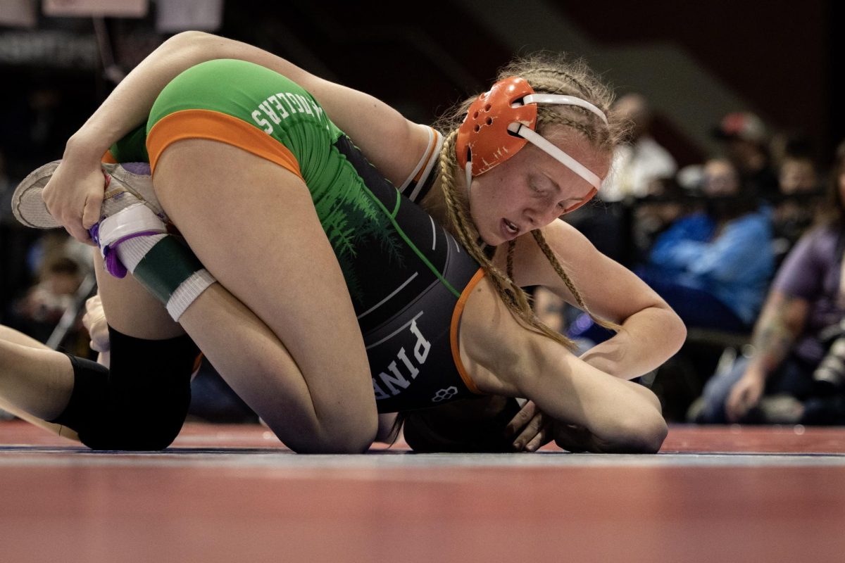 Allison LeBlanc looks to defeat her Pinedale opponent during State Wrestling.