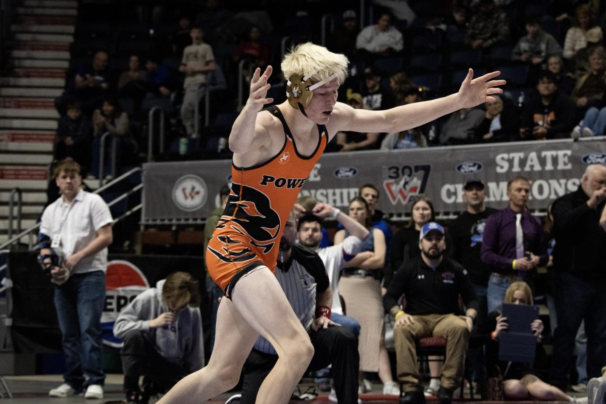 Tyler Wenzel celebrates a victory at the Wyoming state tournament.