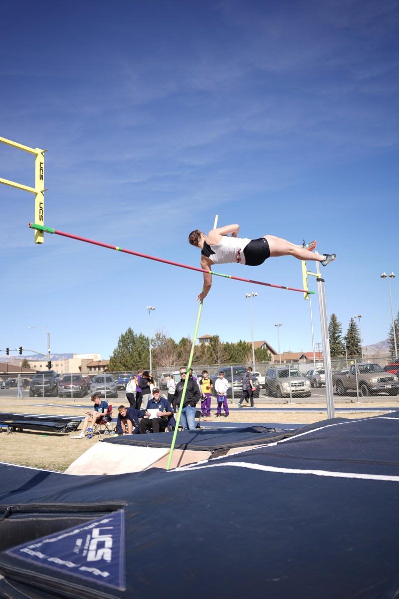 Kate Williams vaults over the bar to place first in the meet, jumping 8’6”