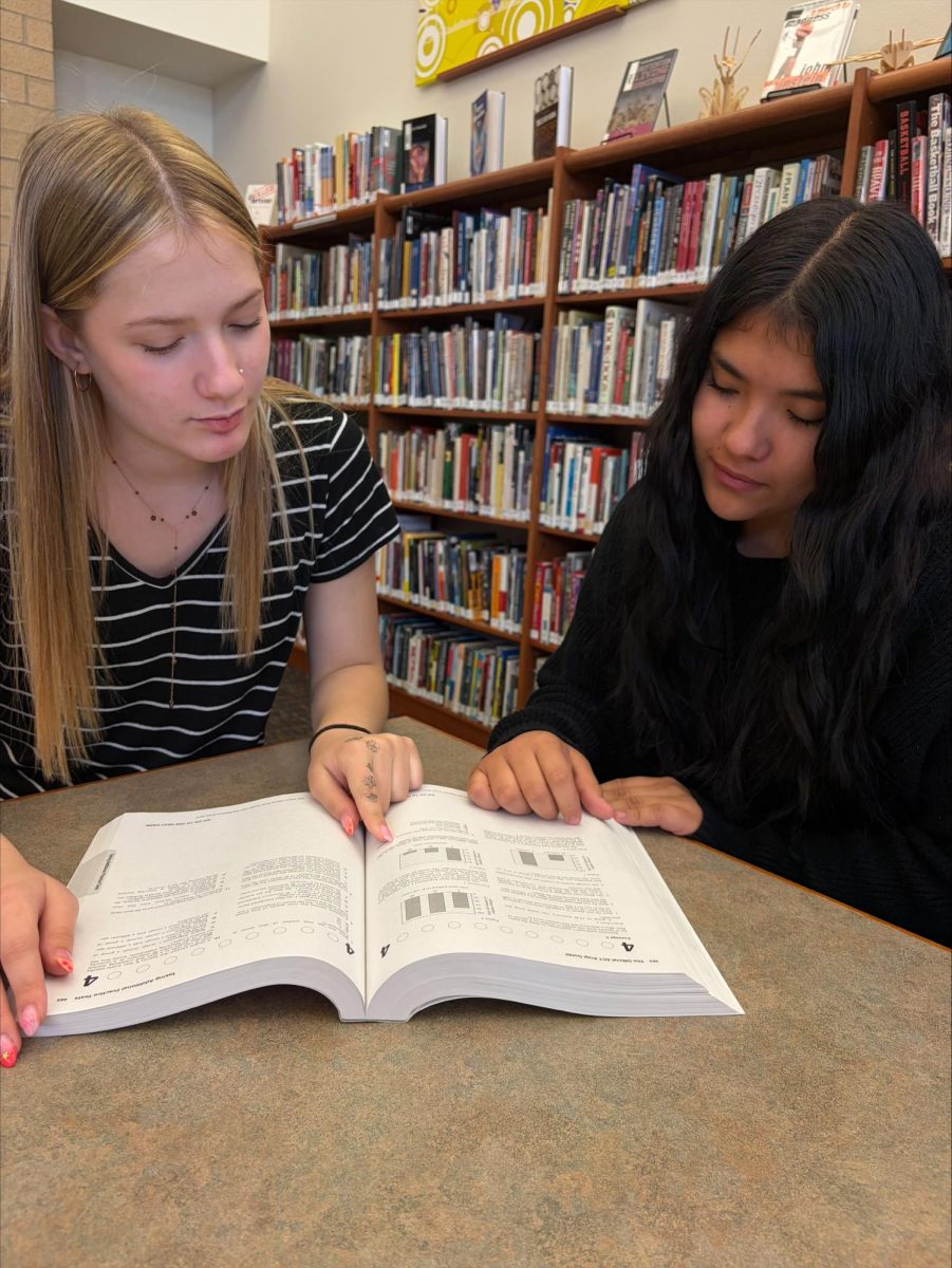 Juniors Adriana Torres and Avalon Rainer obtaining useful information for the ACT.