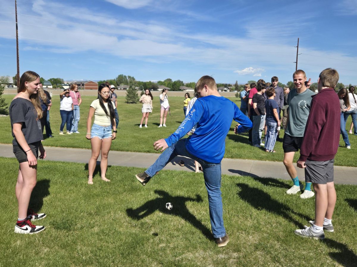 Mr. Scott Smith's students take advantage of a hacky sack opportunity during a last-day-of-school fire drill. 
