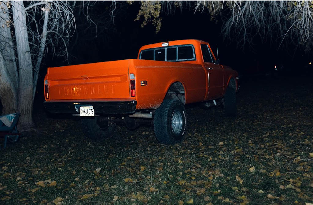 Junior Pratt Wambeke worries about the cost of gas when he fills his orange 1972 Chevy pickup truck.