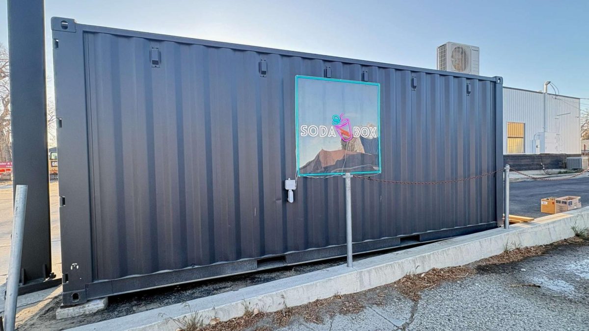 Minimalistic, bright, and neon, the Soda Box logo turns an unsuspecting shipping container into a hub for delicious drinks and snacks. (Courtesy of Alex Smith)