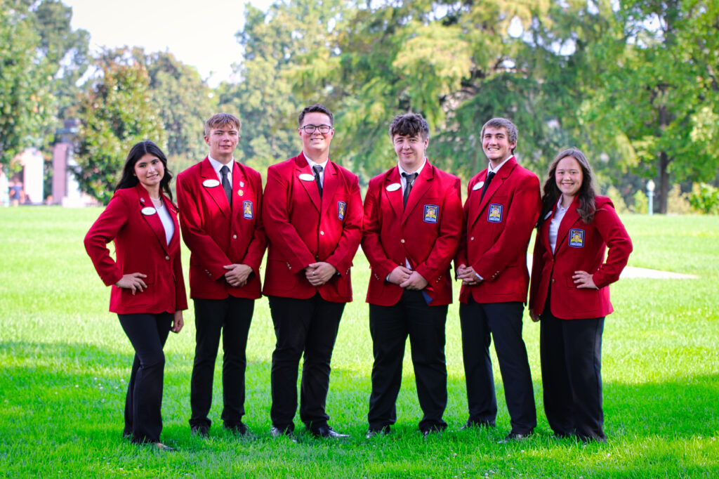 The 2025-2026 SkillsUSA officer team, including PHS's Curtis Muecke (center) and Brooklyn Neves (right), meets in front of the Wyoming State Capitol.
